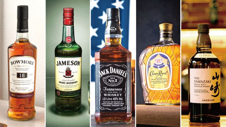Five whisky bottles representing Scotland, Ireland, the United States, Canada, and Japan stand side by side.
