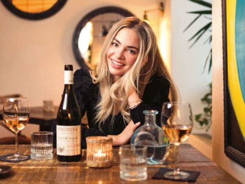 a-woman-enjoying-a-drink-at-home