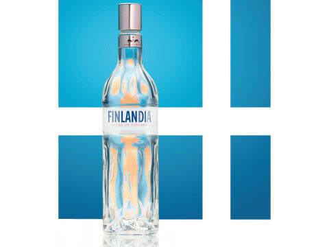 Clear glass bottle of Finlandia vodka set against a blue and white geometric backdrop