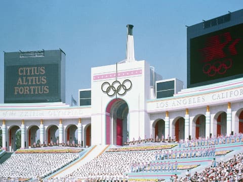 The Olympic rings displayed above the entrance arch of the Los Angeles Memorial Coliseum during the 1984 Summer Olympics opening ceremony