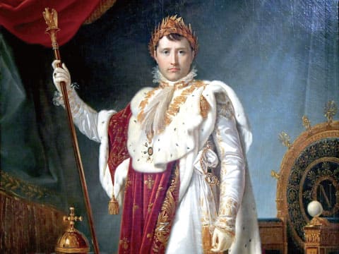 A historical oil painting of Napoleon in ornate coronation robes and a laurel wreath crown, holding an imperial scepter