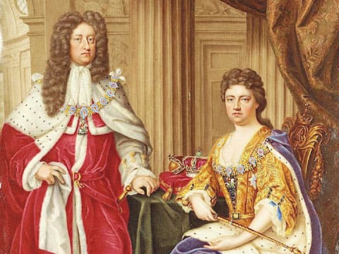 Historical portrait of Queen Anne, the first monarch of the Kingdom of Great Britain, seated in a gold gown beside a man in red ermine-trimmed robes