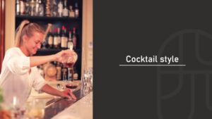 A female bartender pouring a cocktail from a mixing glass into a coupe glass at a bar, next to text reading "Cocktail style"