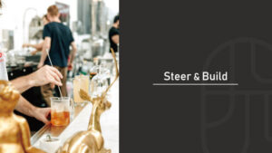 A bartender stirring a cocktail with a bar spoon at a bar counter decorated with golden animal figurines, with "Steer & Build" text overlay