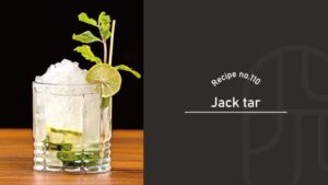 A Jack Tar cocktail with crushed ice piled high in a rocks glass, garnished with a mint sprig and lime wheel, on a wooden bar counter, beside a "Recipe no.110 Jack tar" title card