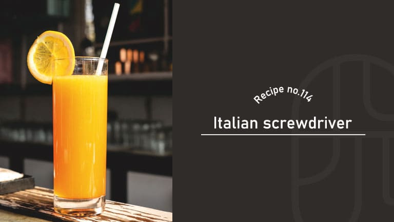 A vibrant orange Italian Screwdriver in a tall glass with a straw, garnished with an orange wheel, on a wooden bar counter, beside a "Recipe no.114 Italian screwdriver" title card