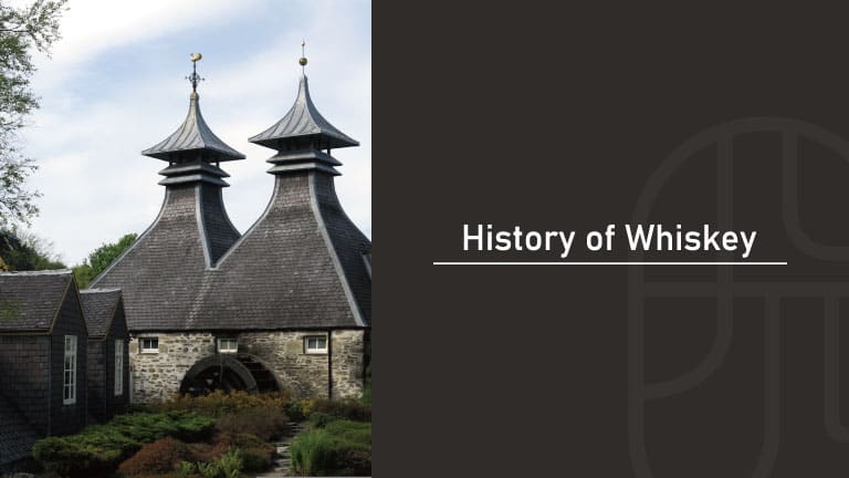 Historic Scotch whisky distillery with twin pagoda roofs and a stone building with a water wheel, with the title “History of Whiskey”