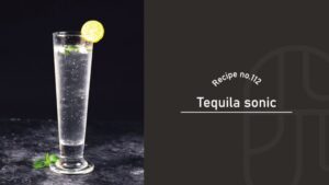 A clear Tequila Sonic in a tall pilsner glass garnished with a lemon wheel and mint, on a dark stone surface, beside a "Recipe no.112 Tequila sonic" title card